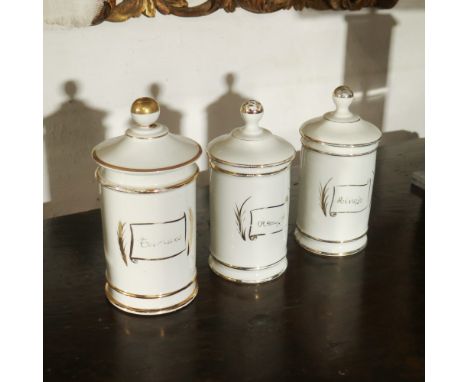 Three white ceramic apothecary jars Italy, 20th centurypartially gildedh. massima 27 cm.