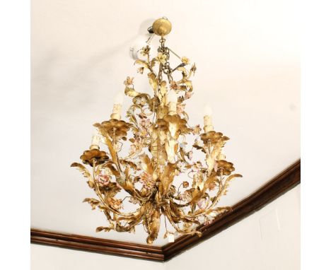 Eight-light chandelier in gilded iron Italy, XIX-XX sec.decorated with vegetal motifs and polychrome flowers, defects70x56 cm