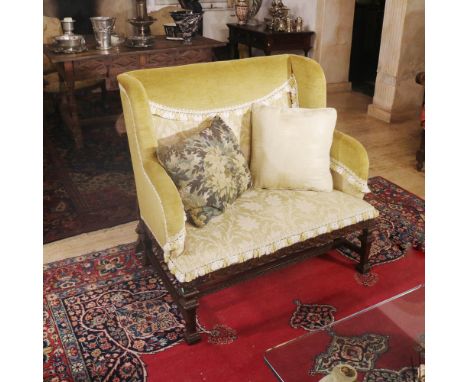 Walnut sofa Italy, 20th centurycarved with floral motifs, fabric upholstered seats and backs106x108x53 cm.