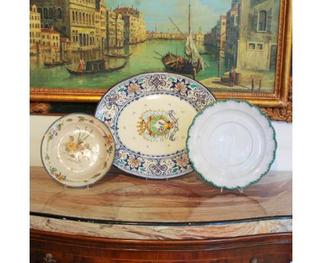 Three ceramic dishes Italy, 20th centurydecorated in polychrome with vegetal and floral motifsm. massima 42x50 cm.