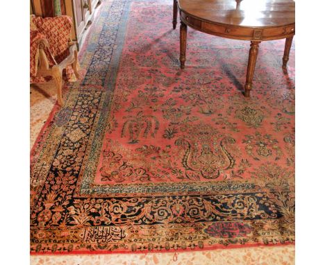 Oriental carpet 20th centurydecorated with floral and vegetal patterns on a blue and red background, wears and defects565x365
