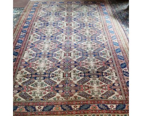Oriental carpet 20th centurydecorated with geometric patterns on a multicolor background, defects290x206 cm.