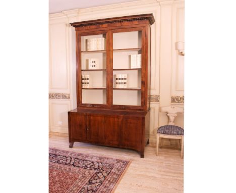 Two-body walnut sideboard Italy, 19th-20th centuryupper part with two open doors, lower part with four closed doors, slight d