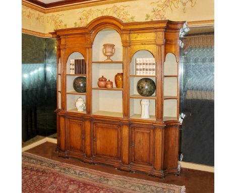 Poplar bookcase Italy, 20th centuryupper part with five open compartments and shelves, partially covered in fabric, lower par