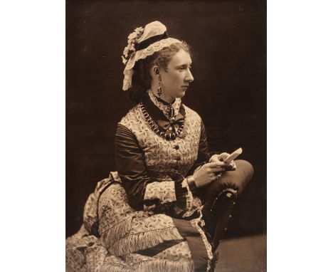 * Framed Photographs. A large-format portrait of a young woman reading a letter, circa 1910, carbon print, 59 x 42 cm, bevell