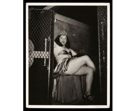 * Weegee (a.k.a. Arthur Fellig, 1899-1968). Drag Queen in a Paddy Wagon, circa 1940s, printed circa 1960s, gelatin silver pri