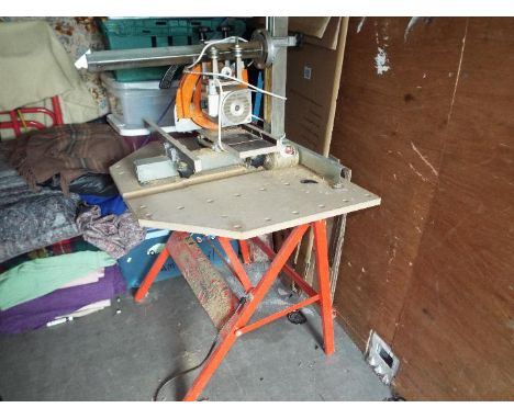 A Eumenia rotary long arm bench saw with Dunlop power work bench, the saw blade diameter 220 mm, blade bore 30 mm, rpm 2800, 