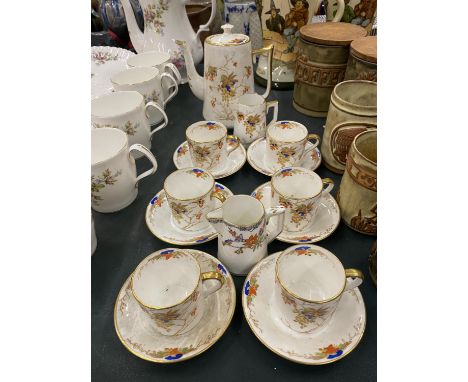 A ROSINA CHINA COFFEE SET TO INCLUDE A COFFEE POT, CREAM JUGS, COFFEE CANS AND SAUCERS 