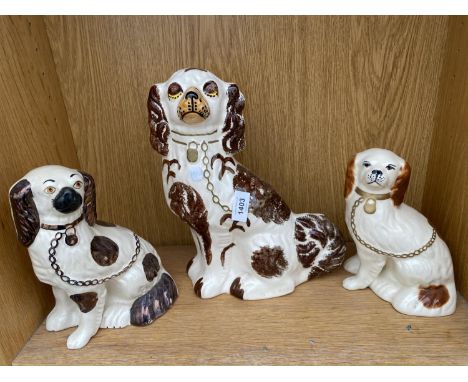 THREE CERAMIC STAFFORDSHIRE SPANIELS 