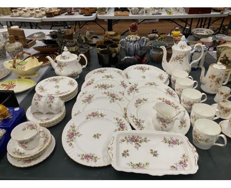 A LARGE QUANTITY OF ROYAL ALBERT 'MOSS ROSE' TO INCLUDE A TEA AND COFFEE POT, CREAM JUG, DINNER AND CAKE PLATES, MUGS, CUPS, 