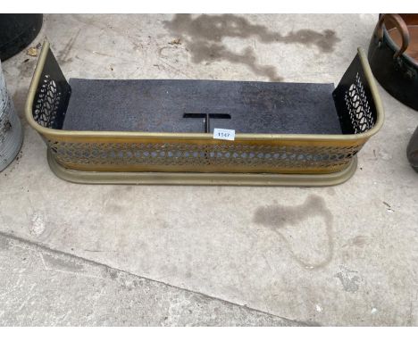 A DECORATIVE VINTAGE BRASS FIRE FENDER 