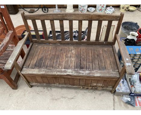 A WOODEN GARDEN BENCH WITH UNDER SEAT STORAGE 