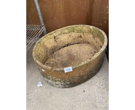 A RECONSTITUTED STONE PLANTER 