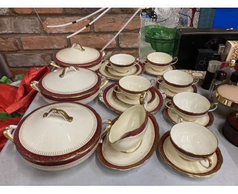 A QUANTITY OF ROYAL ALBERT DINNER WARE WITH A RED BORDER, GOLD FILIGREE ON A CREAM BACKGROUND TO INCLUDE TUREENS, SOUP COUPES