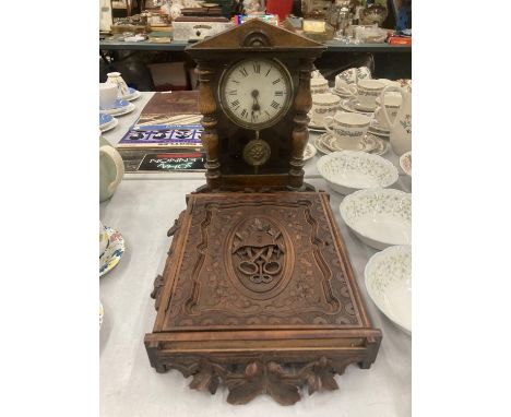 A HEAVILY CARVED OAK KEY BOX WITH ELABORATE DECORATION AND A SMALL MAHOGANY CASED WALL CLOCK WITH PENDULUM - SMALL PIECE OF W