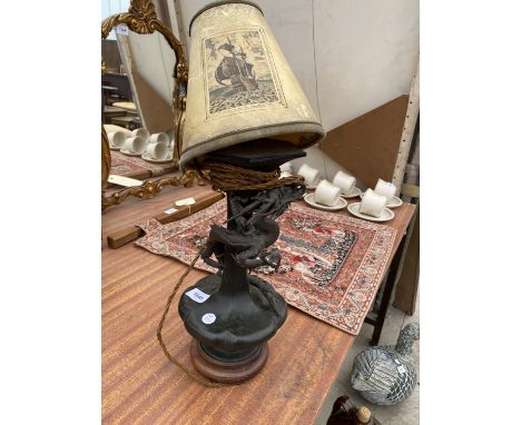 A DECORATIVE BRONZE TABLE LAMP WITH ORIENTAL DRAGON DESIGN 