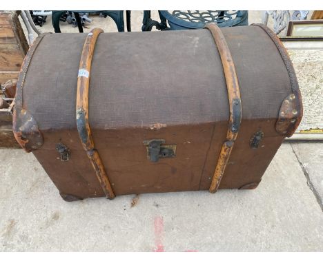 A DOME TOPPED TRAVEL TRUNK BEARING THE INITIALS 'G.D' 