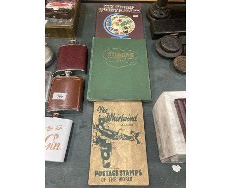 THREE VINTAGE STAMP ALBUMS WITH A VARIETY OF STAMPS 