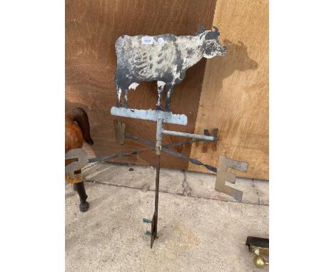 A VINTAGE METAL WEATHER VANE WITH COW TOPPER 