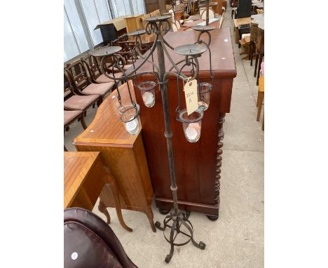 A MODERN WROUGHT IRON STANDARD LAMP WITH FOUR HANGING GLASS CANDLE HOLDERS 
