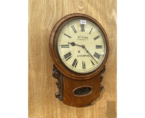 A VINTAGE OAK CASED WALL CLOCK BEARING THE NAME 'W M FISH 6 PRUSSIA ST. LIVERPOOL' 