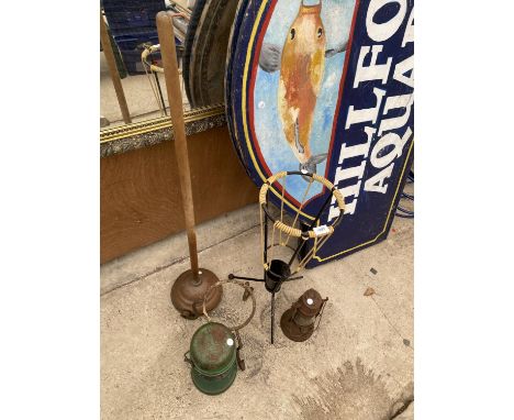 AN ASSORTMENT OF ITEMS TO INCLUDE A COPPER DOLLY POSSER, TWO PARAFIN LAMPS AND A STICK STAND ETC 