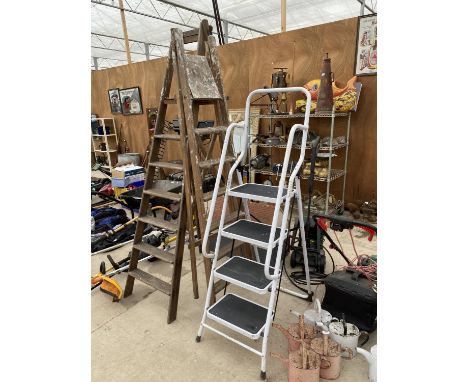 A TUBULAR METAL SET OF STEP LADDERS AND TWO VINTAGE WOODEN STEP LADDERS 