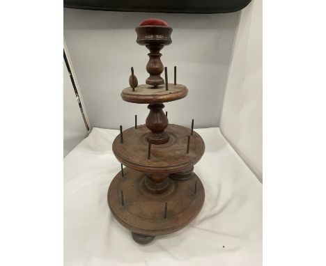 A VINTAGE THREE TIER BOBBIN HOLDER WITH PIN/NEEDLE BOX, PIN CUSHION AND ACORN 