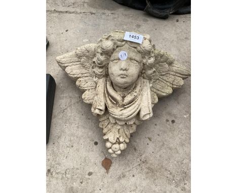 A RECONSTITUTED STONE WALL HANGING CHERUB POCKET PLANTER 