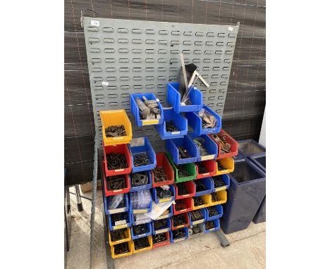 A WORKSHOP DISPLAY BOARD WITH A LARGE ASSORTMENT OF LIN BINS CONTAINING HARDWARE AND TOOLS ETC 