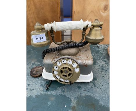 A VINTAGE METAL DIAL TELEPHONE WITH BRASS EAR AND MOUTH PIECE 