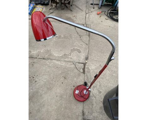 AN ADJUSTABLE FLOOR LAMP 