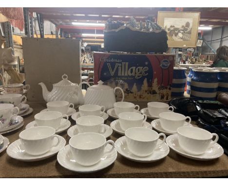 A MINTON WHITE 'FIFE' TEASET TO INCLUDE TWO TEAPOTS, CUPS AND SAUCERS 