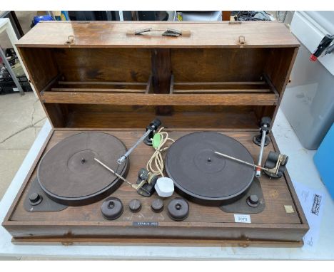 A WOODEN CASED VINTAGE RECORD PLAYER 