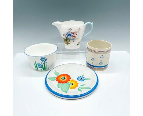 Elegant Shelley grouping with a tea pot trivet, pitcher/creamer, small bowl, and straight-sided cup, all adorned with delicat