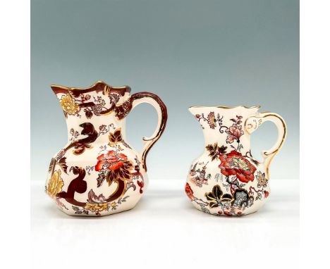 Two pitchers with faceted bodies and warm brown and gold chinoiserie designs over cream-white ground. Mason's backstamps. Lar