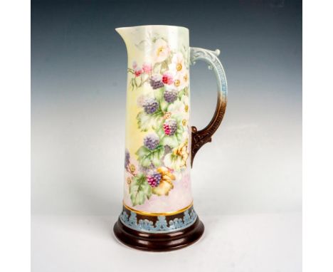 Large Belleek hand painted pitcher or vase decorated with black berries and vines. Marked Belleek to the bottom. Issued: 20th