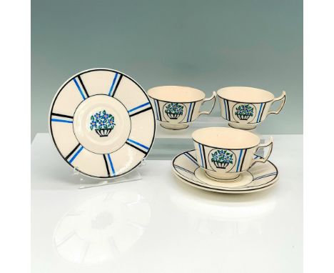A set of 3 teacups and 3 saucers that have a blue flower bunch painted on each item with blue and black vertical stripes on t