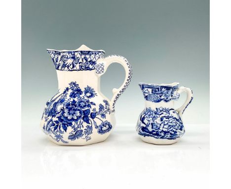 Pair of ironstone china pitchers with classic blue and white chinoiserie designs including birds, peonies, and patterns. Maso
