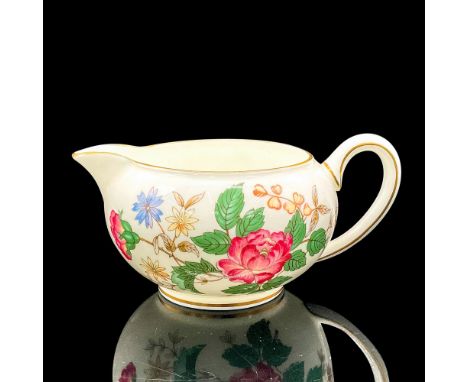 Bone china pitcher with a dark pink, blue and white floral design; gilt rim and accents. Wedgwood backstamp. Dimensions: 5.5"