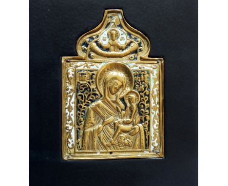 Russian brass and enamel champleve icon, the holy mother and child beneath ogee arch, in black wooden frame, 15cm x 14cm over