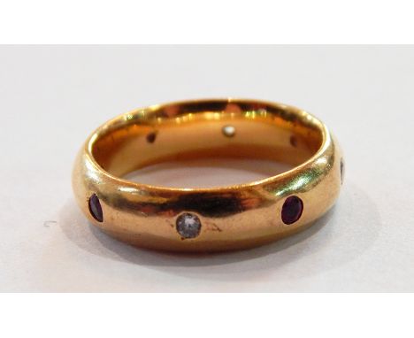 18ct gold, diamond and garnet ring the stone set into rounded band 