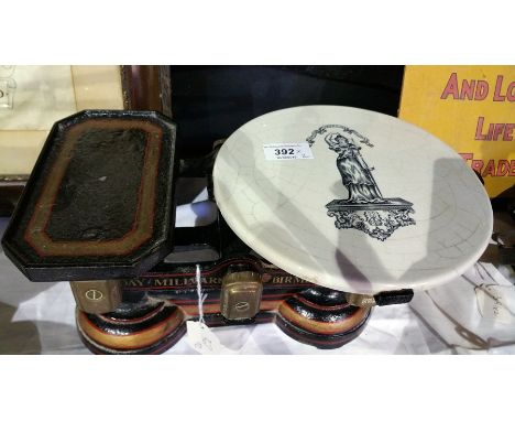 Weighing scales with brass buckets and nine weights and Day Milward, Birmingham weighing scales with porcelain base (2) 