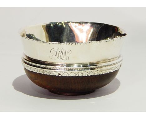 Early 20th century silver-mounted coconut cup with wavy and hammered rim and engraved borders, bearing initials, Sheffield 19