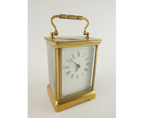 Early 20th century brass carriage timepiece clock, rectangular white dial marked with Roman numerals 10.5cm h. 