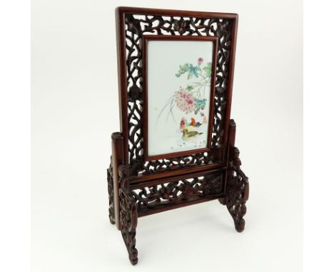 19/20th Century Chinese Hand Painted Porcelain Plaque Mounted in Carved Hardwood Frame As Table Screen. Decorated with colorf