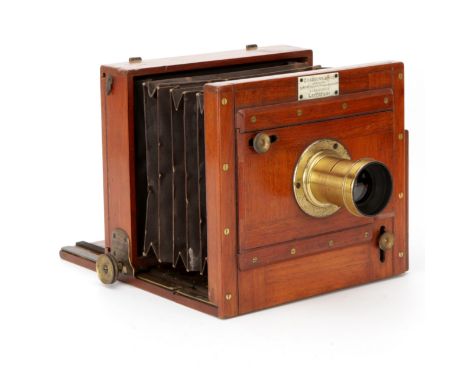 A Chadburn & Son Half Plate Mahogany Tailboard Camera, 1861, with unmarked Waterhouse stop brass lens, body, VG, lens, G, som