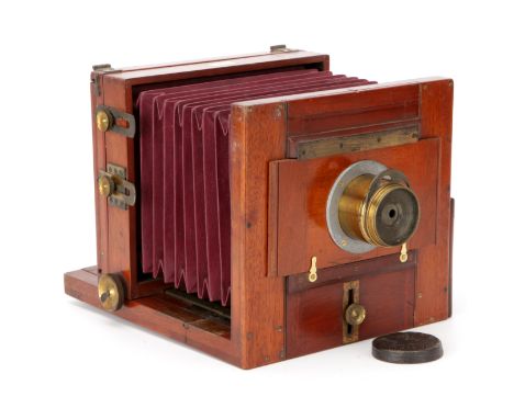A Reyolds & Branson Studio Half Plate Mahogany Tailboard Camera, 1890, with unmarked rotary Waterhouse stop brass lens, stamp