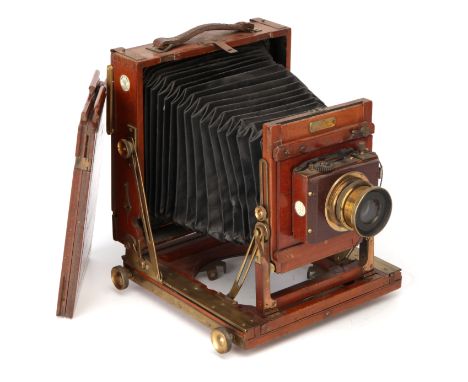 A Houghtons Victo Half Plate Mahogany Field Camera, 1900, with Beck Symmetrical f/8 brass lens, in Thornton-Pickard shutter, 