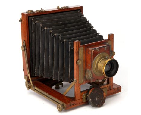 An Unmarked Half Plate Mahogany Field Camera, 1900, with Unmarked f/8 brass lens, in shutter, body, F-G, shutter not working,